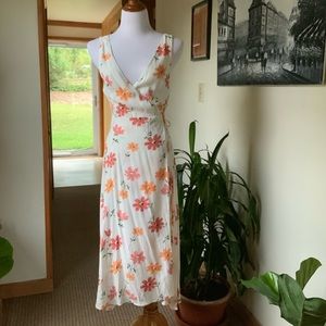 Low cut v-neck floral wrap dress with scoop back.